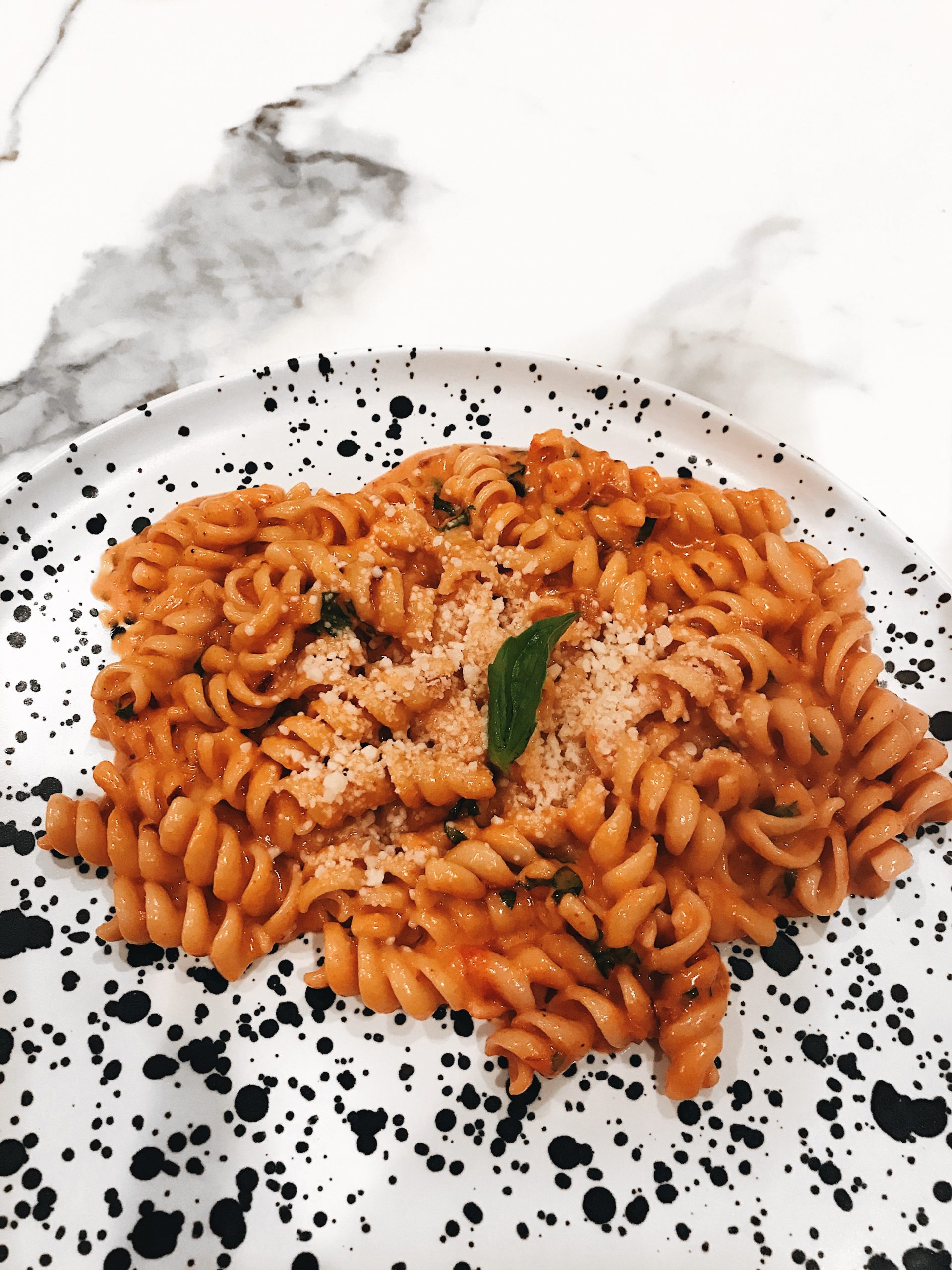 Jon and Vinnys Spicy Fusilli with Vodka Sauce Basil and Parmesan Copycat Recipe scaled